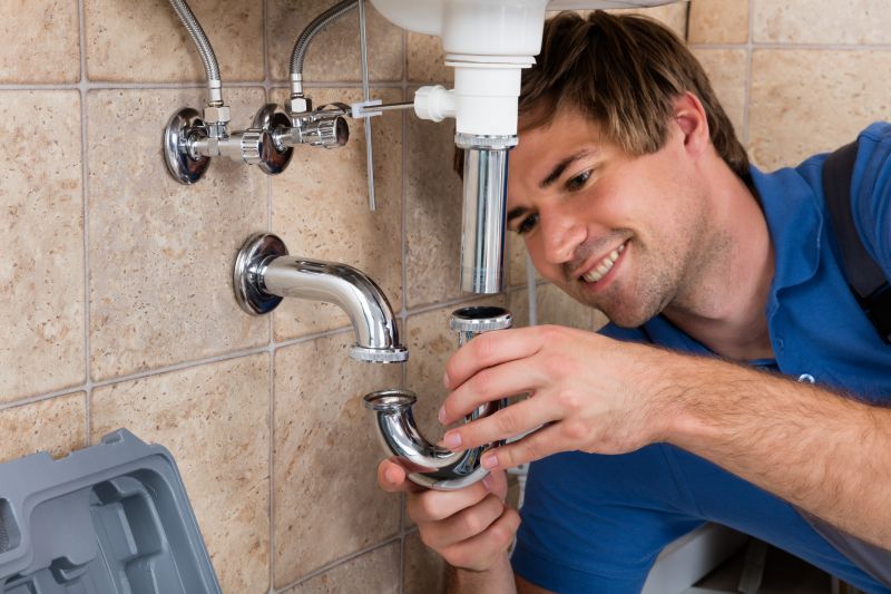 Plumber installing new fixtures